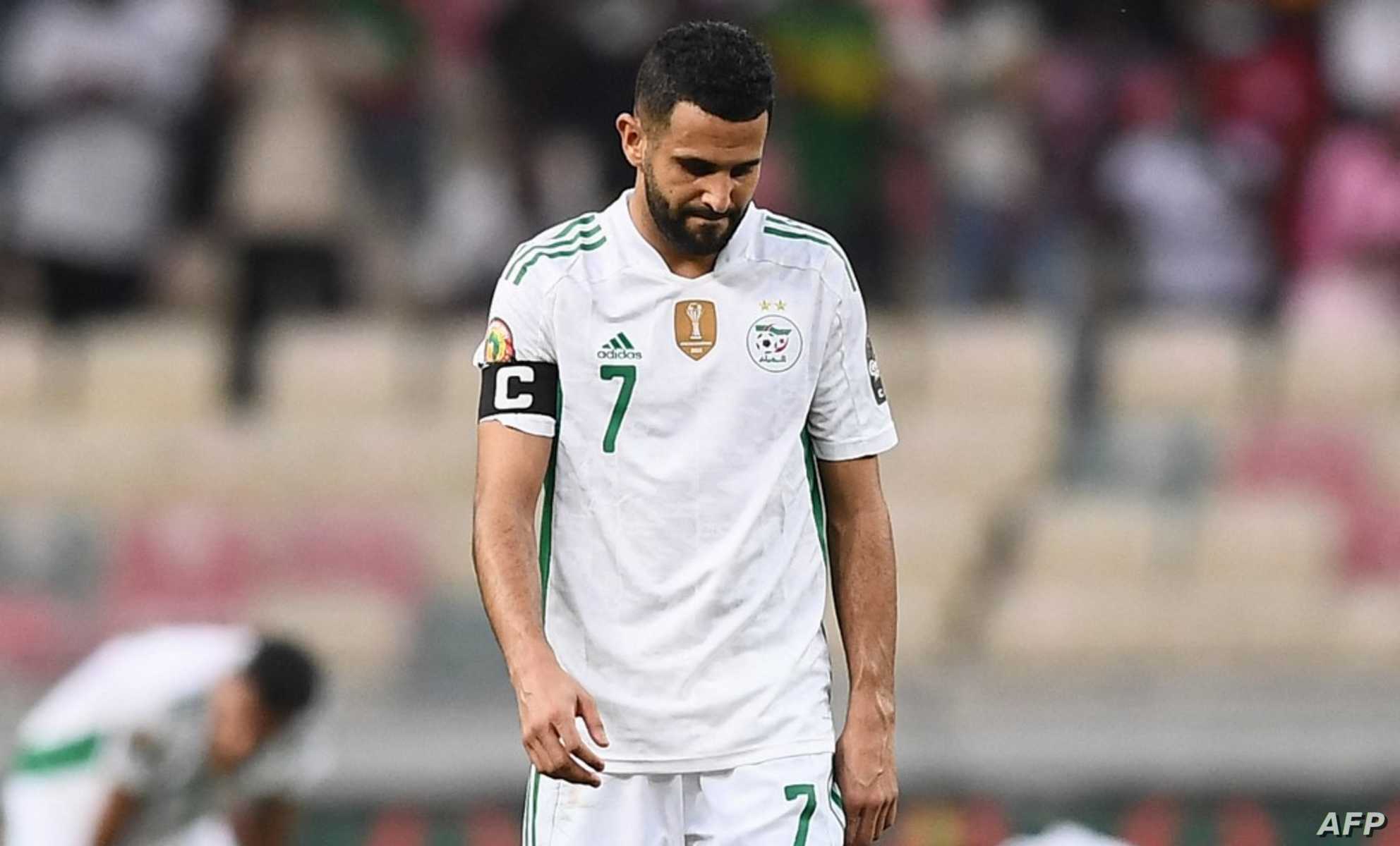 Algeria's forward Riyad Mahrez reacts after Ivory Coast's forward Nicolas Pepe (not seen) scored Ivory Coast's third goal during the Group E Africa Cup of Nations (CAN) 2021 football match between Ivory Coast and Algeria at Stade de Japoma in Douala on January 20, 2022. (Photo by CHARLY TRIBALLEAU / AFP)