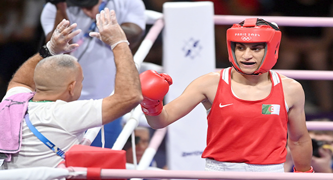 PARIS, FRANCE - AUGUST 1: Algeria's Imane Khelif (in red) during the Women's 66kg preliminary round match against Angela Carini of Italy (not seen) on day six of the Olympic Games Paris 2024 at North Paris Arena on August 01, 2024 in Paris, France. (Photo by Fabio Bozzani/Anadolu via Getty Images)