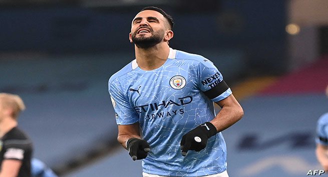 Manchester City's Algerian midfielder Riyad Mahrez celebrates after scoring the opening goal of the English Premier League football match between Manchester City and Burnley at the Etihad Stadium in Manchester, north west England, on November 28, 2020. (Photo by Laurence Griffiths / POOL / AFP) / RESTRICTED TO EDITORIAL USE. No use with unauthorized audio, video, data, fixture lists, club/league logos or 'live' services. Online in-match use limited to 120 images. An additional 40 images may be used in extra time. No video emulation. Social media in-match use limited to 120 images. An additional 40 images may be used in extra time. No use in betting publications, games or single club/league/player publications. /